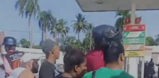 Identifican a policía y civil muertos a tiros mutuamente en estación de combustible en Villa Mella